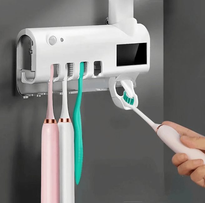 Toothpaste dispenser with sterilizer