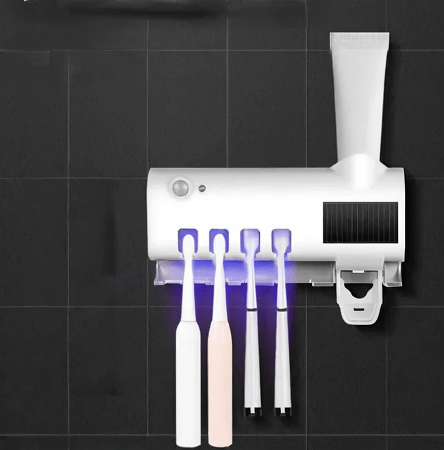 Toothpaste dispenser with sterilizer